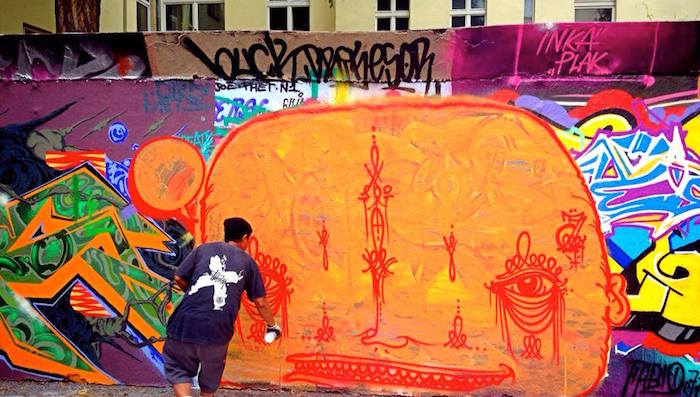 Rolly Love Hate Love sprays mural in yogykarta Keep Berlin Weird
